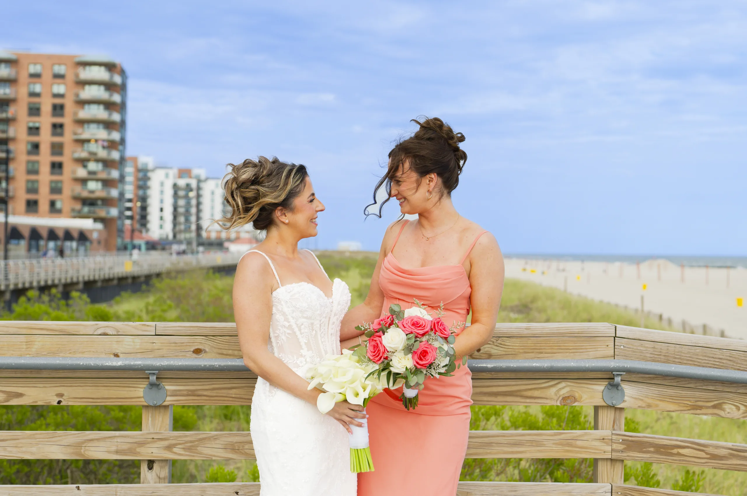 Bride with a bridesmaid outdoors
